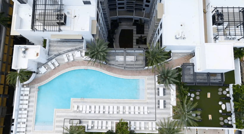 aerial of pool showing near tropical landscaping