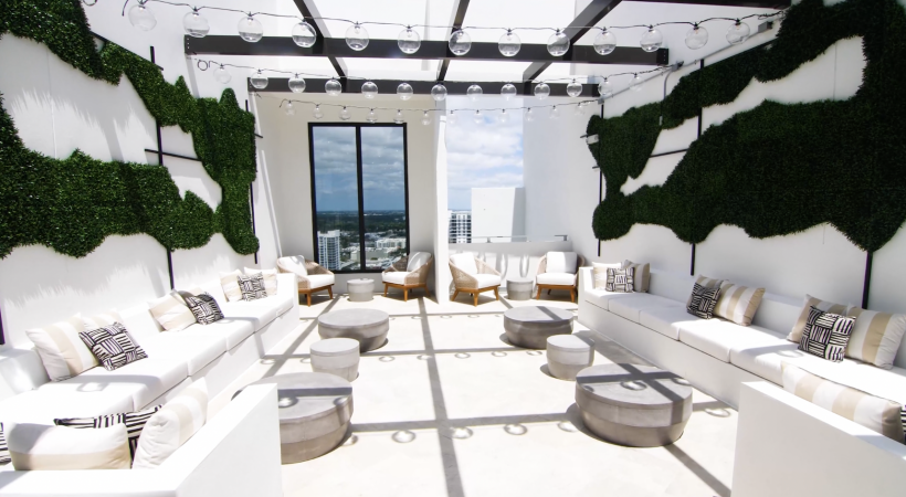 rendering of spacious lounge with seating and city views