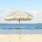 A umbrella sitting-in the sand on the beach