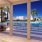 Large sparkling blue resort style pool with ample lounge chairs for laying out and relaxing at The Registry Las Olas