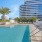 large swimming pool with cabanas