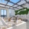 Long couches, coffee tables and wicker chairs on the roofrop lounge at The Registry Las Olas