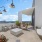 social seating areas on rooftop patio with beautiful city views
