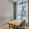 desk and two chairs in well lit study/meeting room