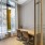 tabe and chairs next to large window in ground level study area