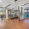 yoga studio with spin cycles and ample lighting throughout