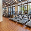 The Registry Las Olas' well equipped fitness center with ample lighting throughout